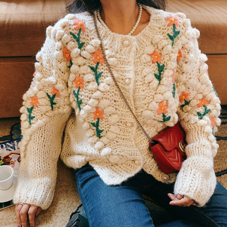 Cardigan with shop pom poms